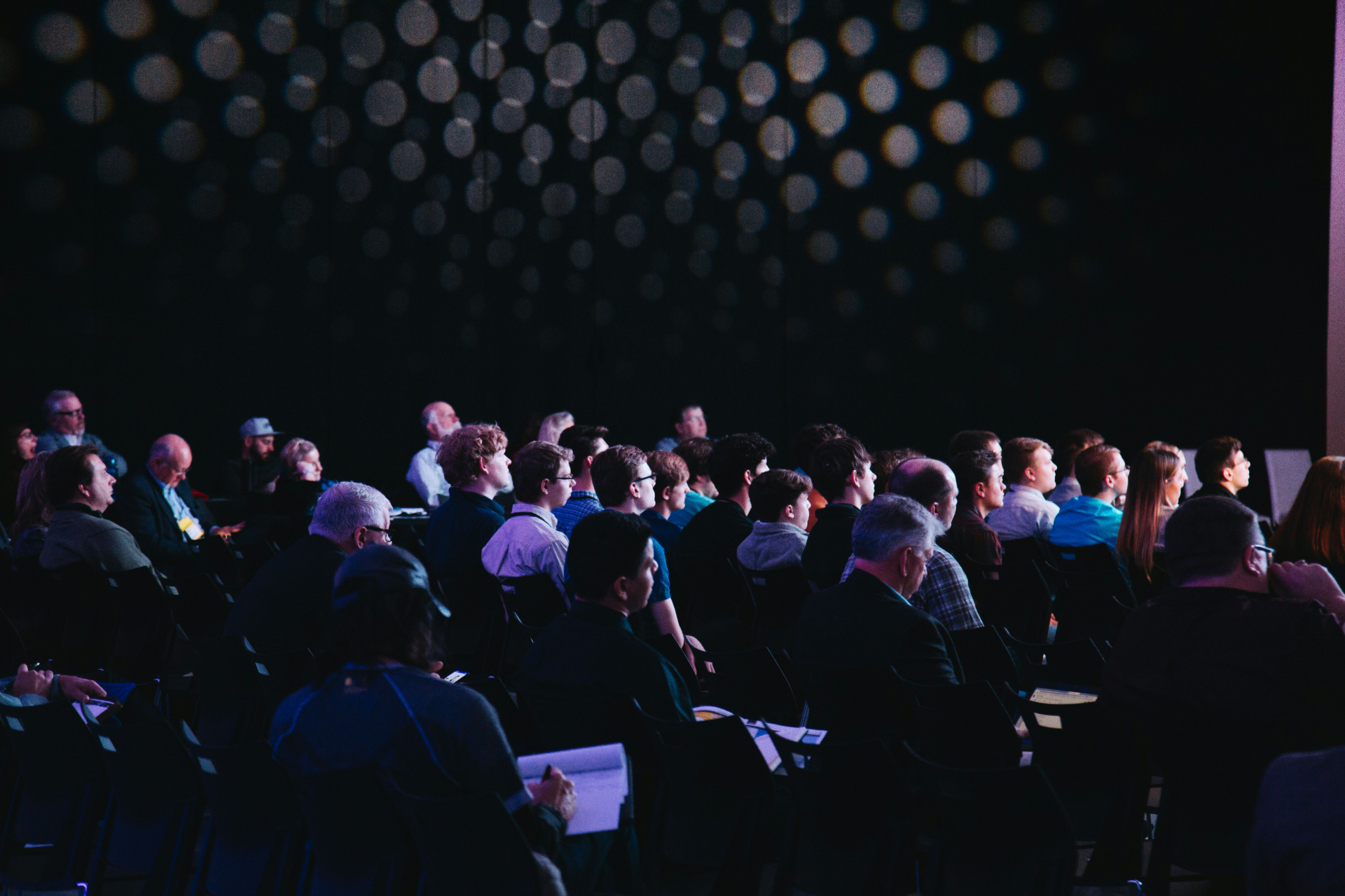 Delegates seated in the main-stage auditorium at a Black Sky summit